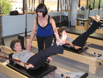 At Absolute Pilates in Albany Lynda and two clients work in the studio